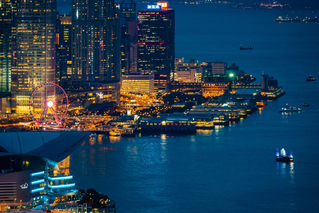 Hong Kong harbor with landscape view of city skyscraper skyline building, China business landmark